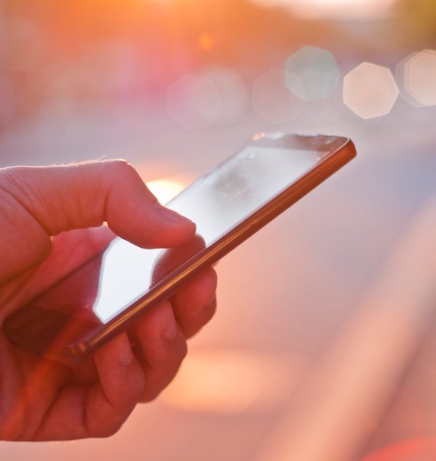 Accountant Viewing the booking system dashboard on mobile phone